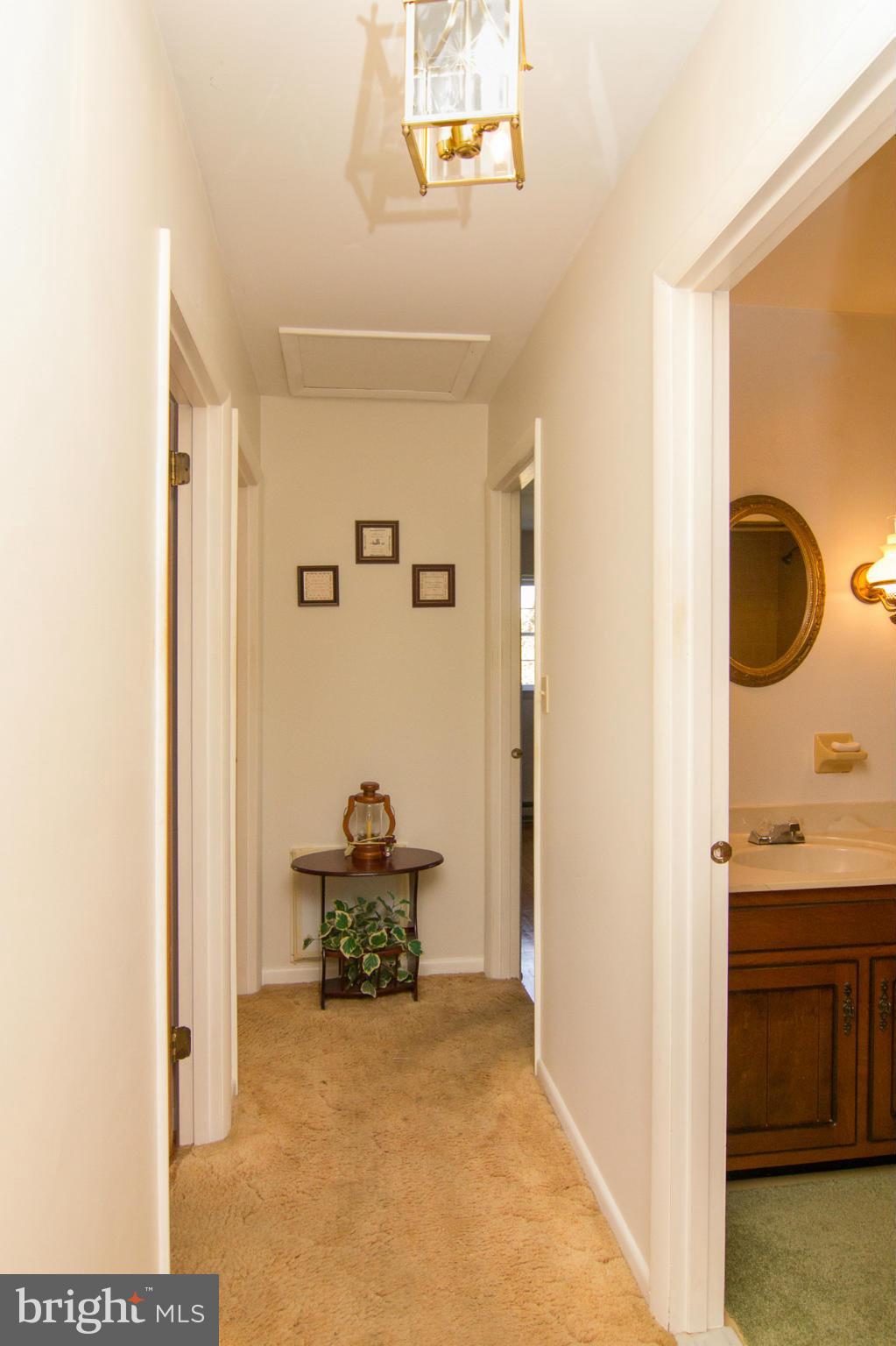 2514 Neudecker Road Westminster, MD 21157 - Photo 9 of 30 a view of a hallway to a livingroom and a livingroom with furniture