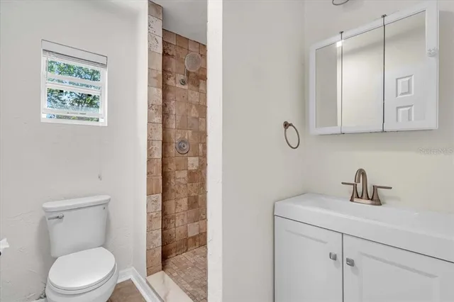 a bathroom with 2 sink and a toilet