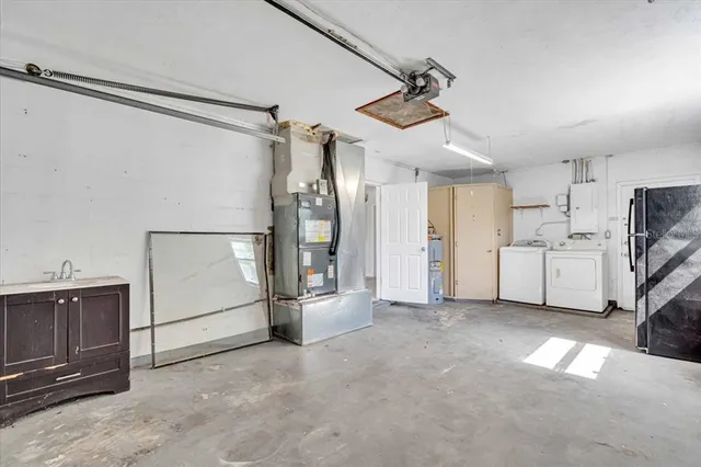 a view of a house with a yard and garage