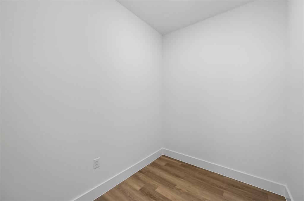 100 Cardinal Wds Granbury, TX 76049 - Photo 19 of 36 Unfurnished room featuring wood finished floors and baseboards
