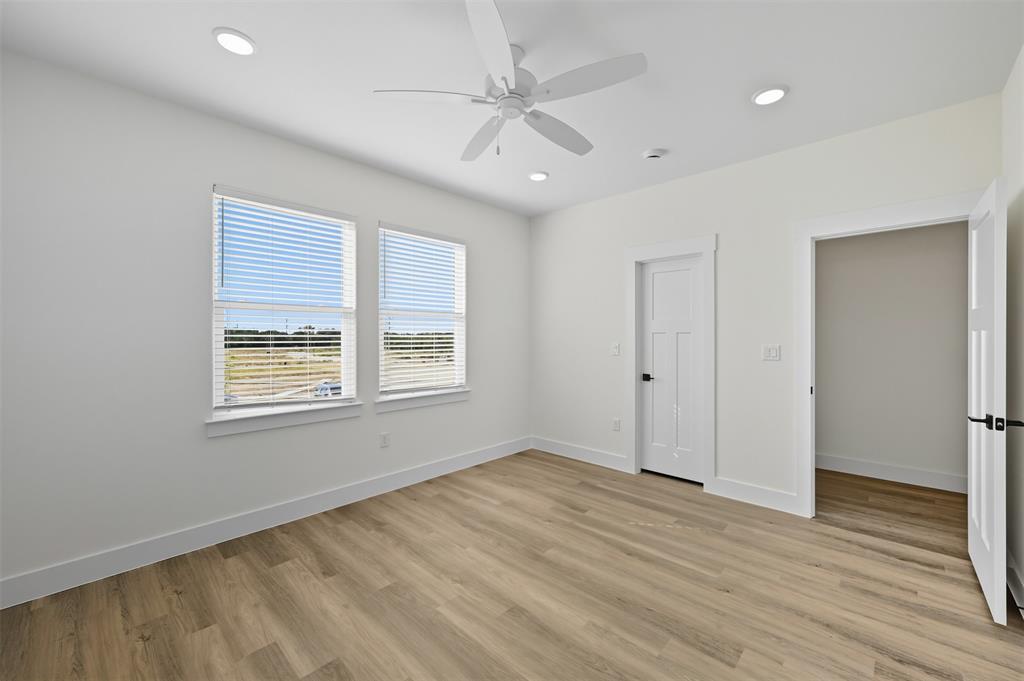100 Cardinal Wds Granbury, TX 76049 - Photo 21 of 36 Unfurnished bedroom featuring light wood-style floors, recessed lighting, and ceiling fan