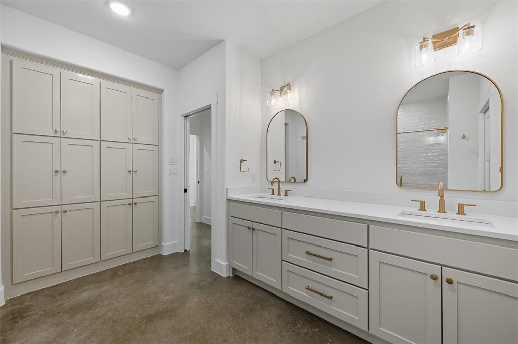 100 Cardinal Wds Granbury, TX 76049 - Photo 27 of 36 Full bath featuring finished concrete floors, double vanity, a shower, and a closet