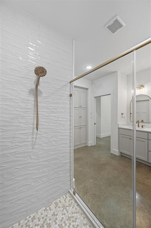 100 Cardinal Wds Granbury, TX 76049 - Photo 28 of 36 Bathroom featuring walk in shower, vanity, and concrete floors