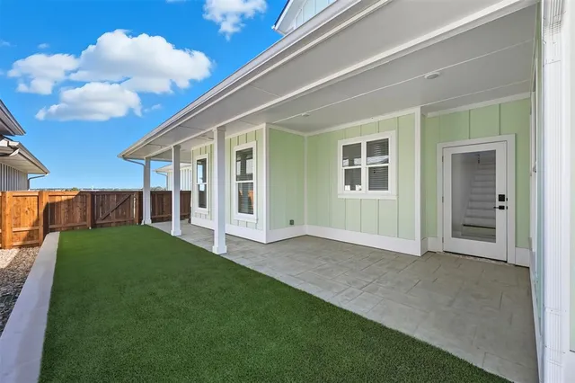 a kitchen with white cabinets and a stove