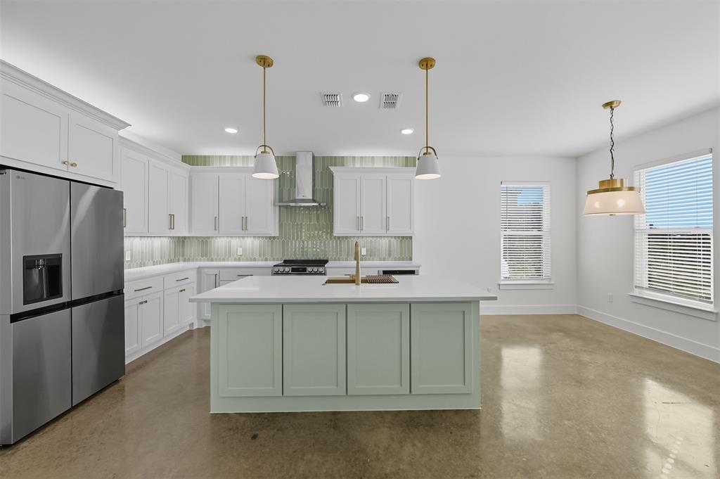 100 Cardinal Wds Granbury, TX 76049 - Photo 8 of 36 Kitchen featuring white cabinets, stainless steel appliances, backsplash, a kitchen island with sink, and recessed lighting