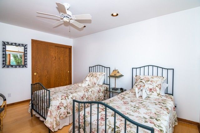 a bedroom with furniture and a chandelier