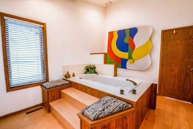 a living room with a rug and a window