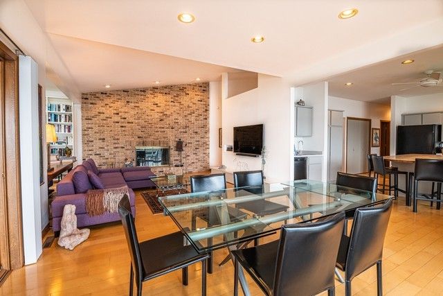 a living room with fireplace furniture and a flat screen tv