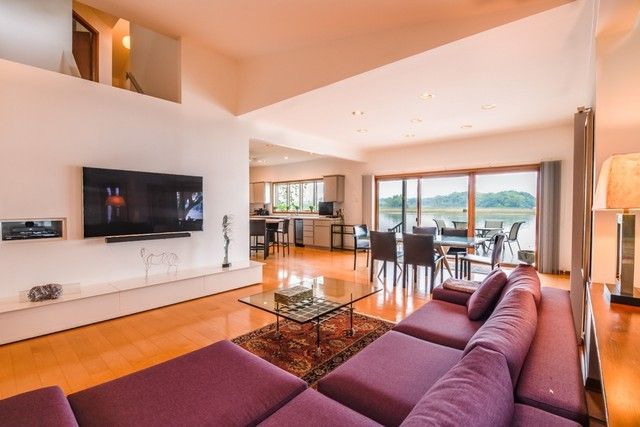 a living room with furniture and a flat screen tv