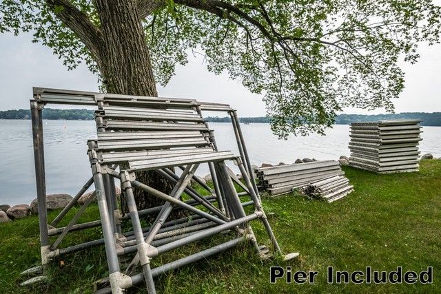 a view of a backyard with sitting area