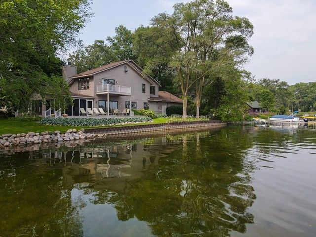 a house with river in front of it