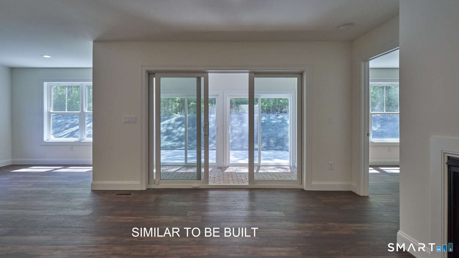 16 Jordan Lane Colchester, CT 06415 - Photo 9 of 19 a view of an empty room with wooden floor and a window