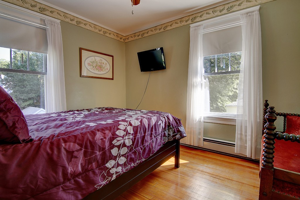 60-62 Meadow Road Woonsocket, RI 02895 - Photo 15 of 25 a bedroom with a bed and a flat screen tv