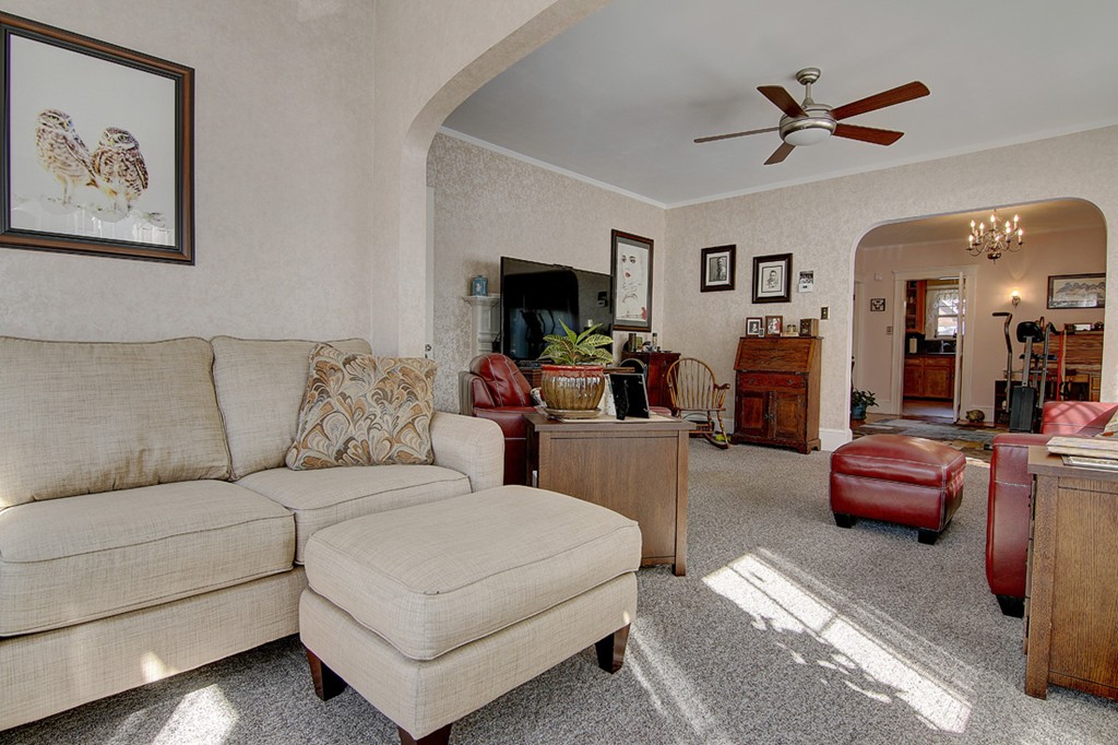 60-62 Meadow Road Woonsocket, RI 02895 - Photo 6 of 25 a living room with furniture a flat screen tv and a ceiling fan