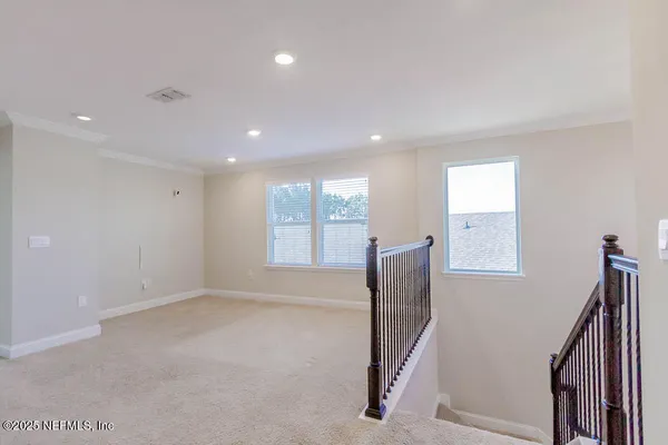a view of entryway with stairs