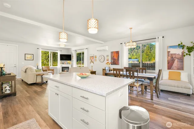 a large white kitchen with a large window