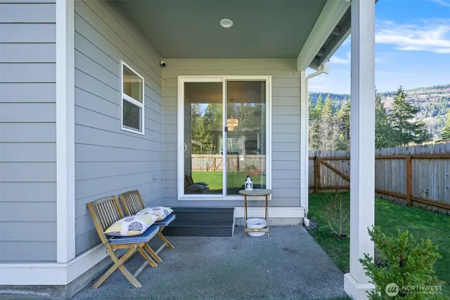 a house view with a bench and garden
