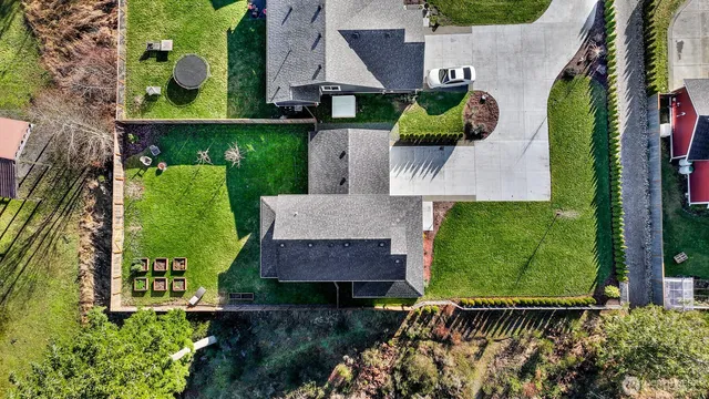 an aerial view of a house with a garden