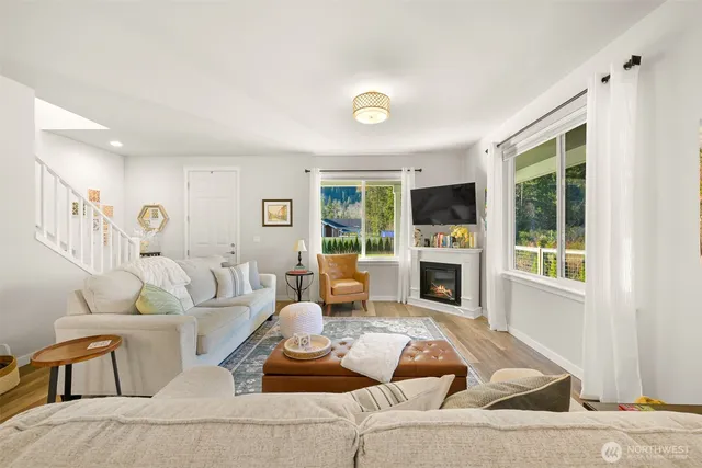 a living room with furniture and a fireplace
