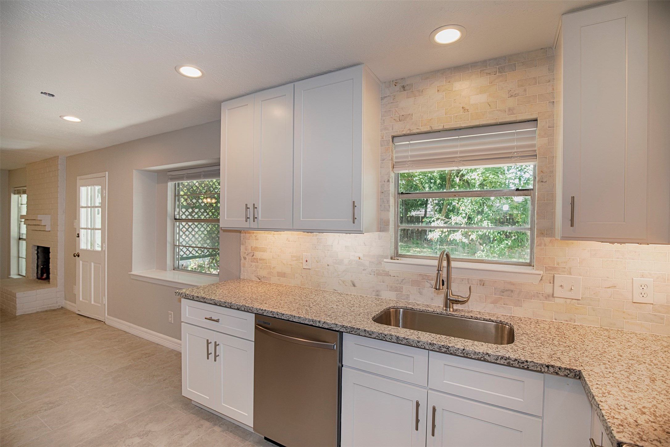 802 Wavecrest Lane Houston, TX 77062 - Photo 13 of 32 The kitchen window overlooks the wonderful backyard.