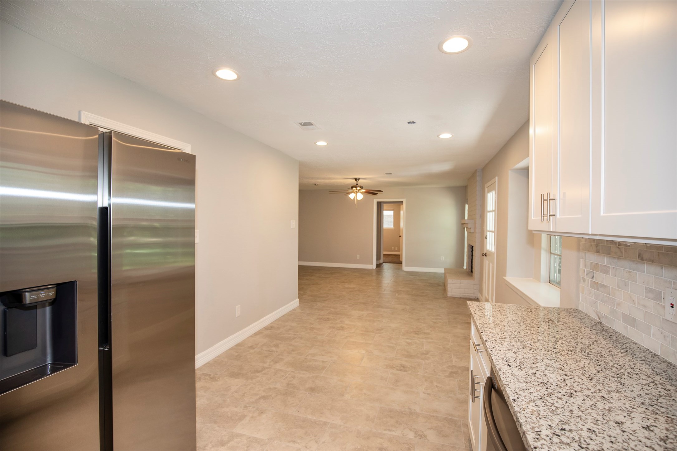 802 Wavecrest Lane Houston, TX 77062 - Photo 14 of 32 A view from the kitchen looking to the dining area and family room.