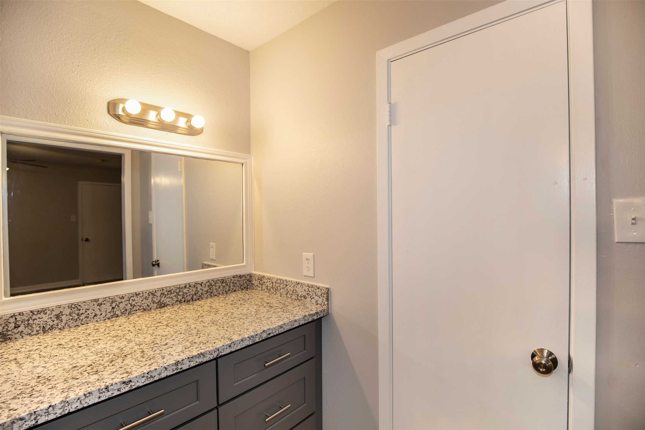 802 Wavecrest Lane Houston, TX 77062 - Photo 18 of 32 This fantastic vanity sits between the bathroom and closet and features terrific storage space.