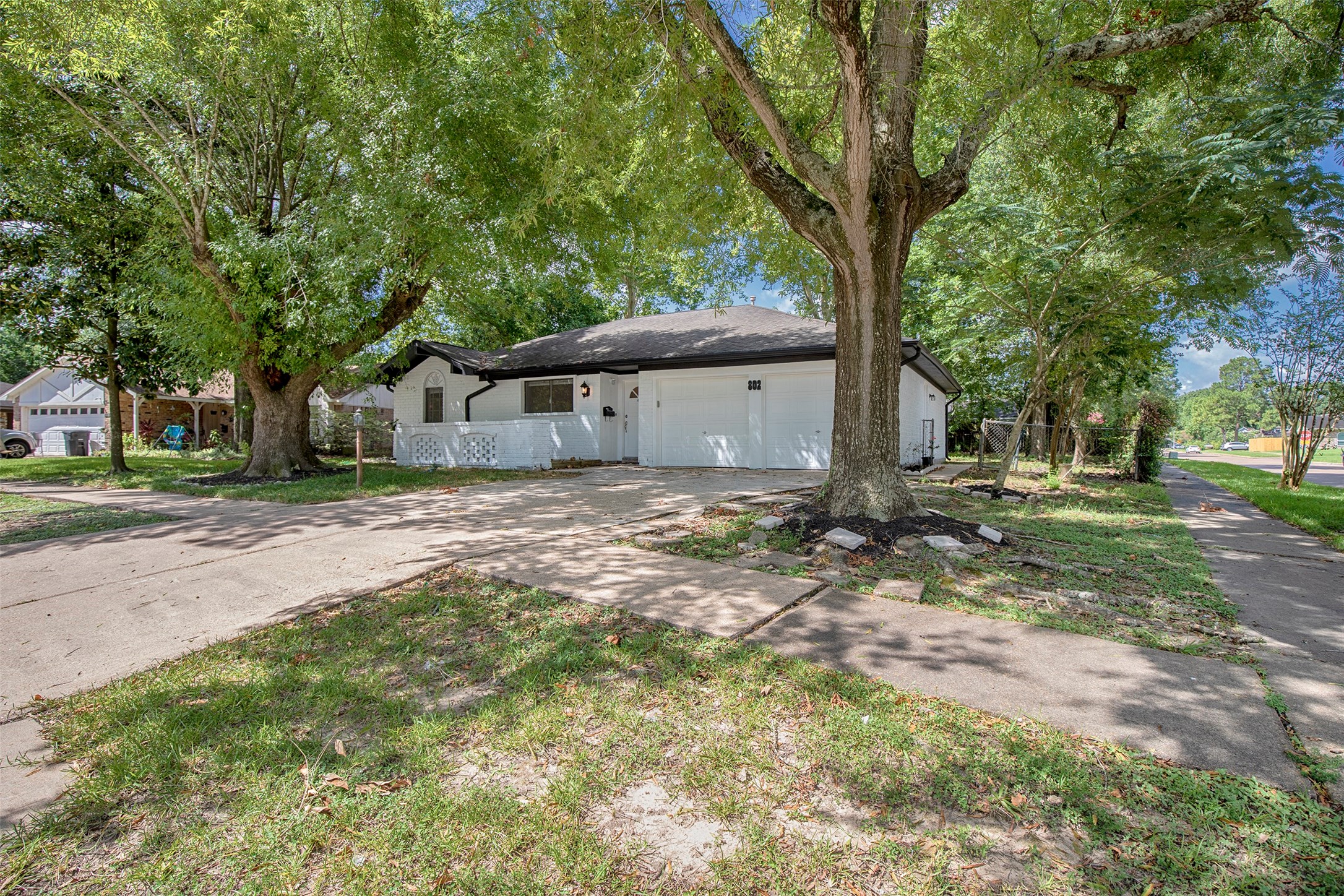 802 Wavecrest Lane Houston, TX 77062 - Photo 2 of 32 The large matrure trees provide wonderful shade on those hot summer days.