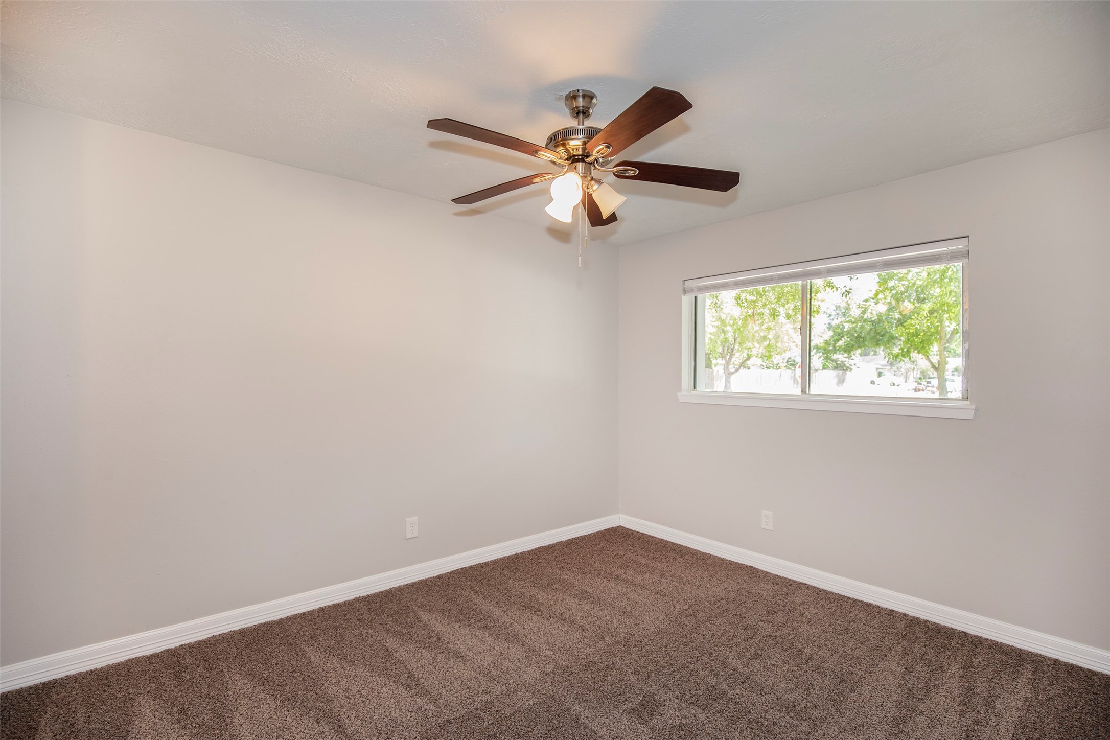 802 Wavecrest Lane Houston, TX 77062 - Photo 26 of 32 The bedrooms have beautiful carpet flooring and wonderful ceiling fans.