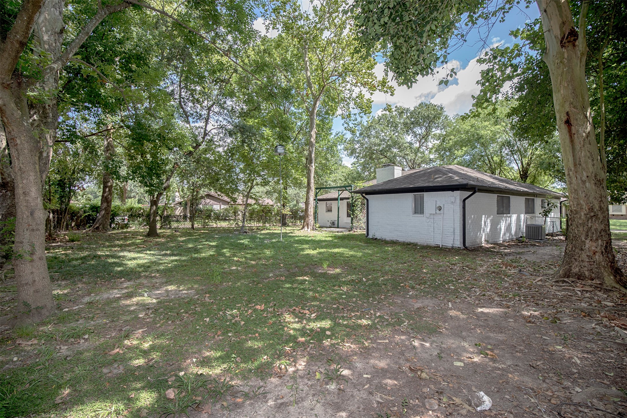802 Wavecrest Lane Houston, TX 77062 - Photo 30 of 32 Another view of the backyard looking toward the house.