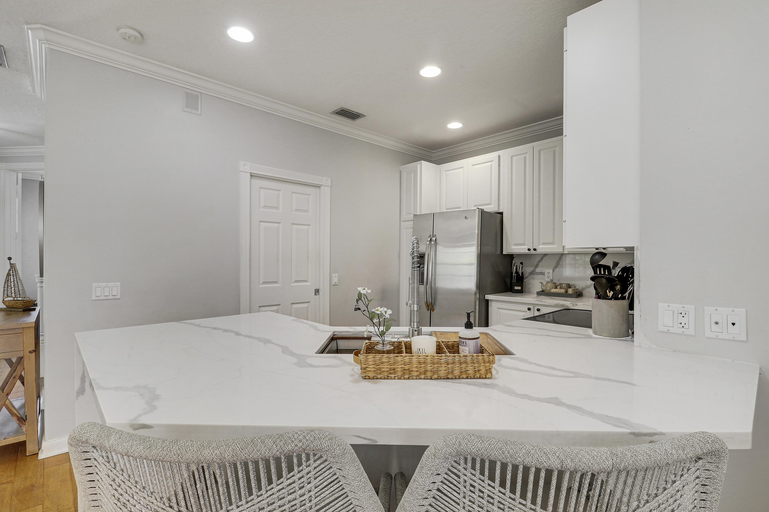 131 Rockingham Road Jupiter, FL 33458 - Photo 13 of 40 a living room with a patio and a couch