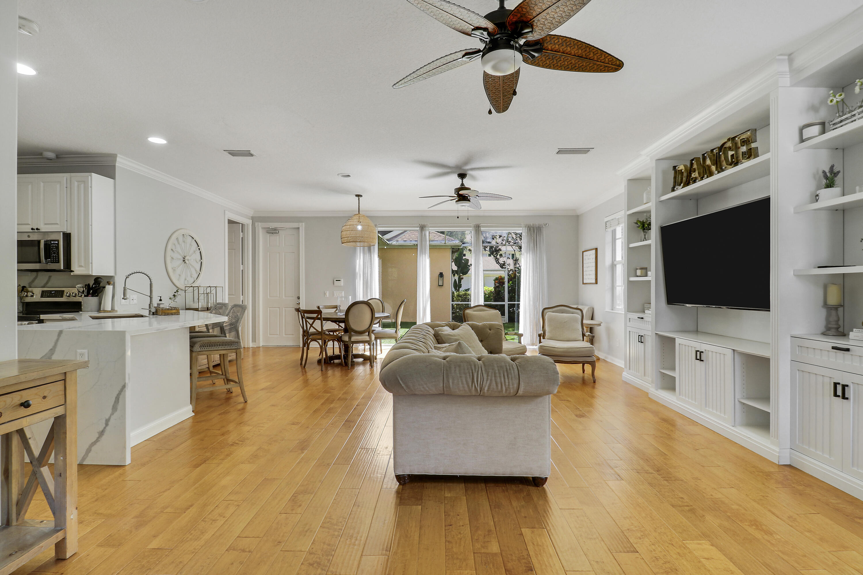 131 Rockingham Road Jupiter, FL 33458 - Photo 15 of 40 a living room with furniture and a flat screen tv