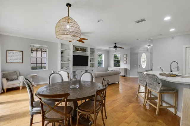 a view of a dining room with furniture window and wooden floor