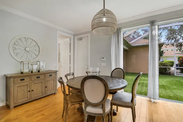 a view of a livingroom with furniture window and wooden floor