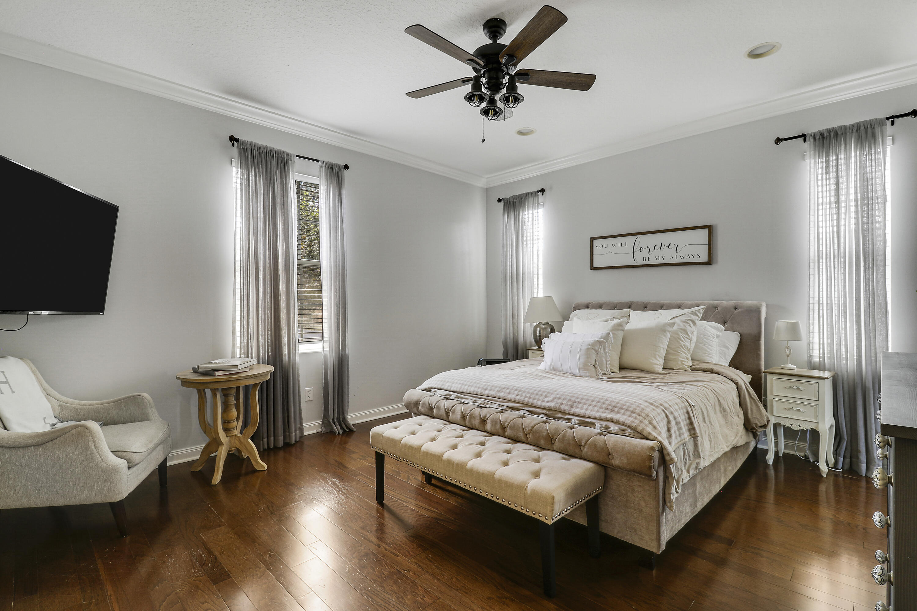 131 Rockingham Road Jupiter, FL 33458 - Photo 23 of 40 a bedroom with a bed and a flat screen tv