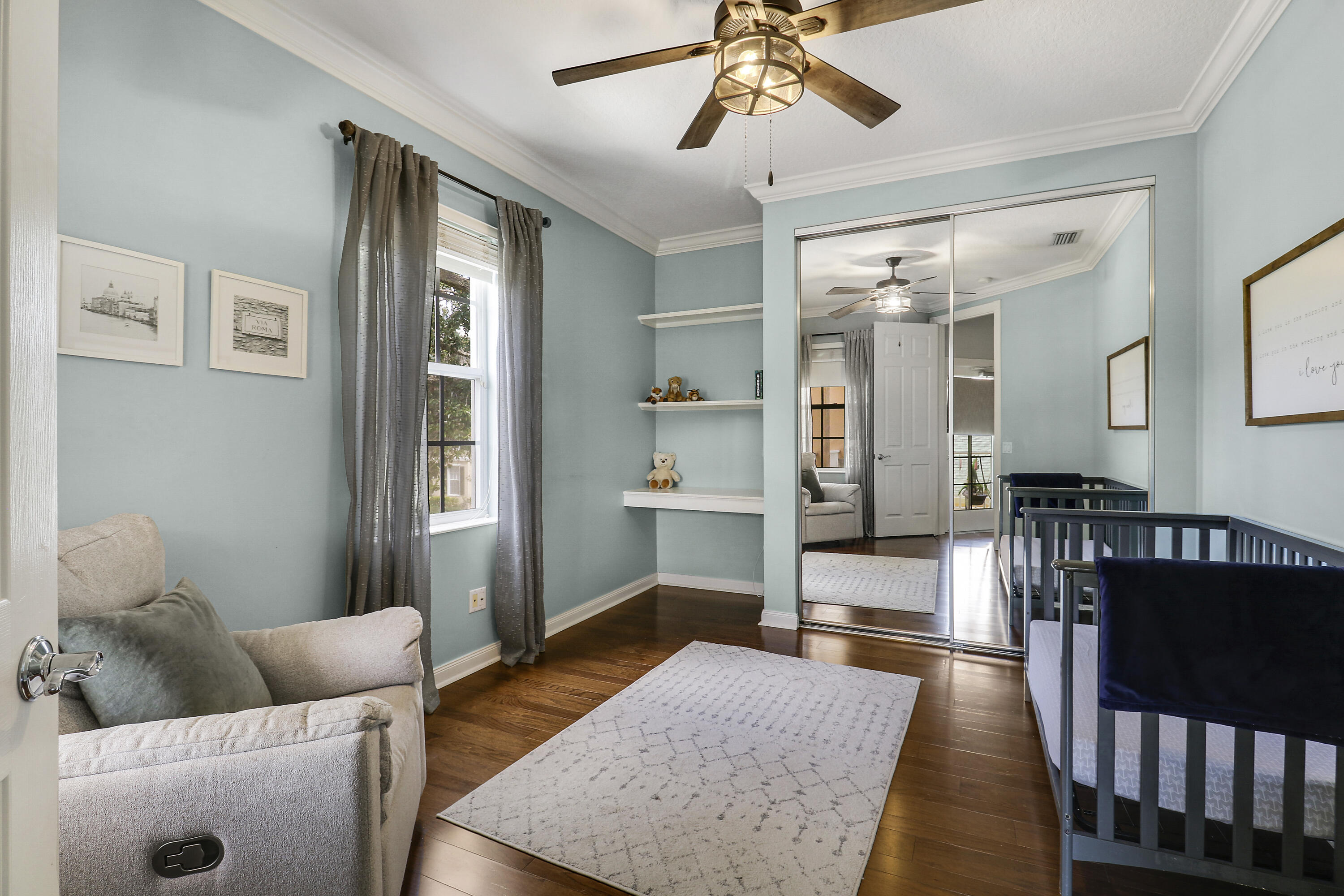 131 Rockingham Road Jupiter, FL 33458 - Photo 27 of 40 a living room with furniture and wooden floor
