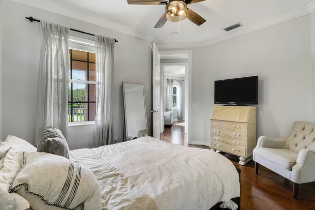 a bedroom with a bed and a television