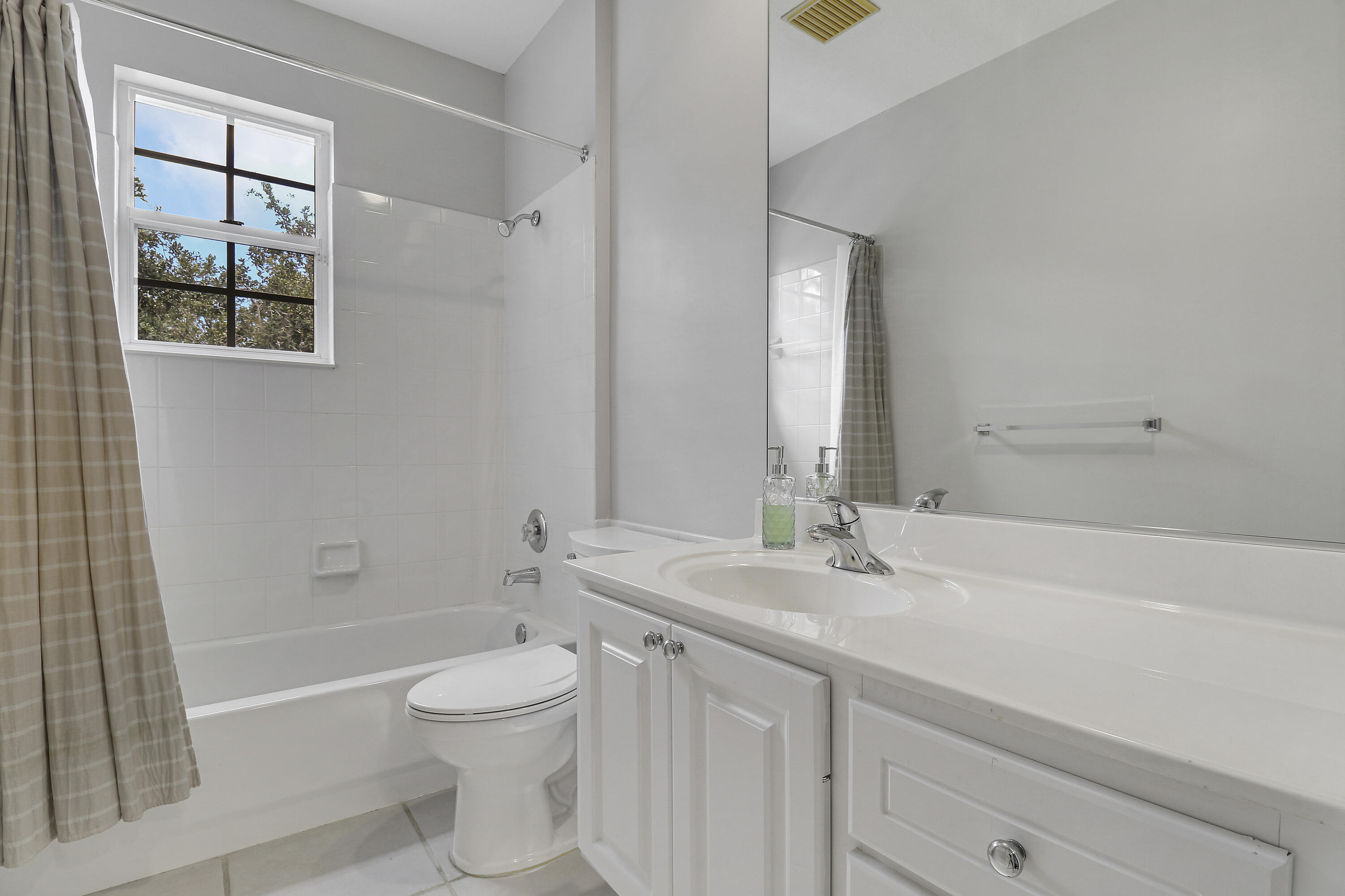 131 Rockingham Road Jupiter, FL 33458 - Photo 30 of 40 a bathroom with a sink a toilet and shower