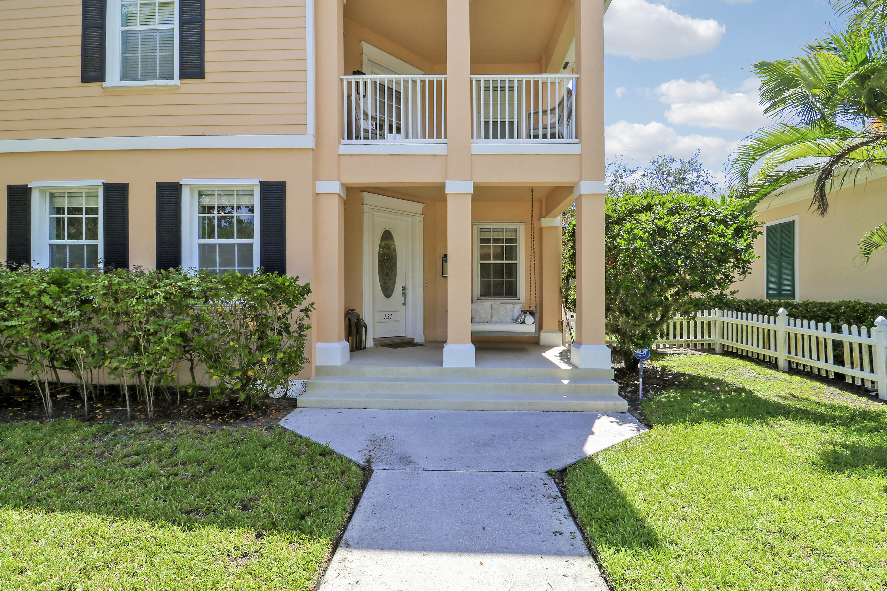 131 Rockingham Road Jupiter, FL 33458 - Photo 3 of 40 a view of a building with a yard