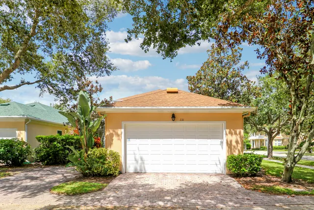 a front view of house with garden