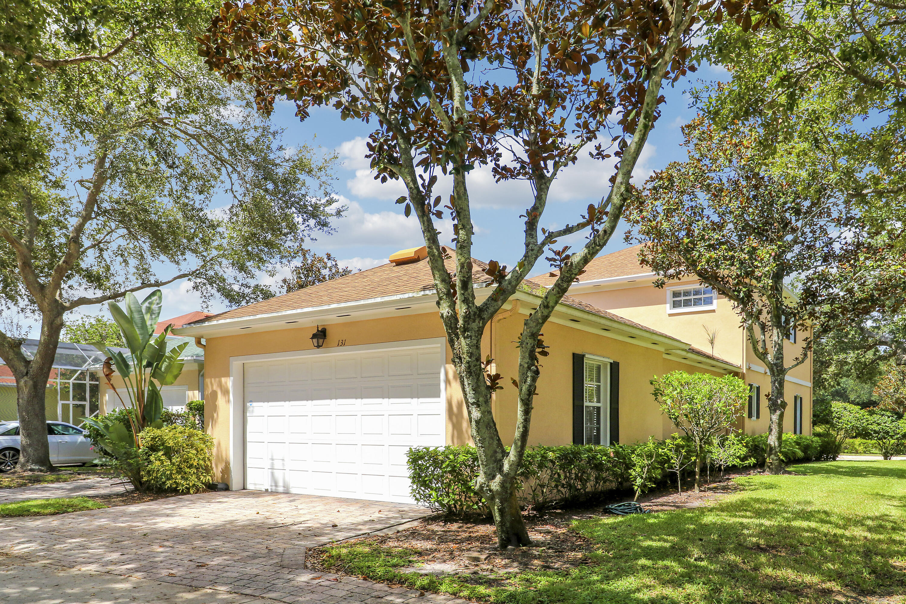 131 Rockingham Road Jupiter, FL 33458 - Photo 39 of 40 a front view of a house with garden