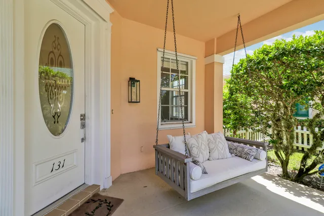 a spacious bedroom with a bed a mirror and a window