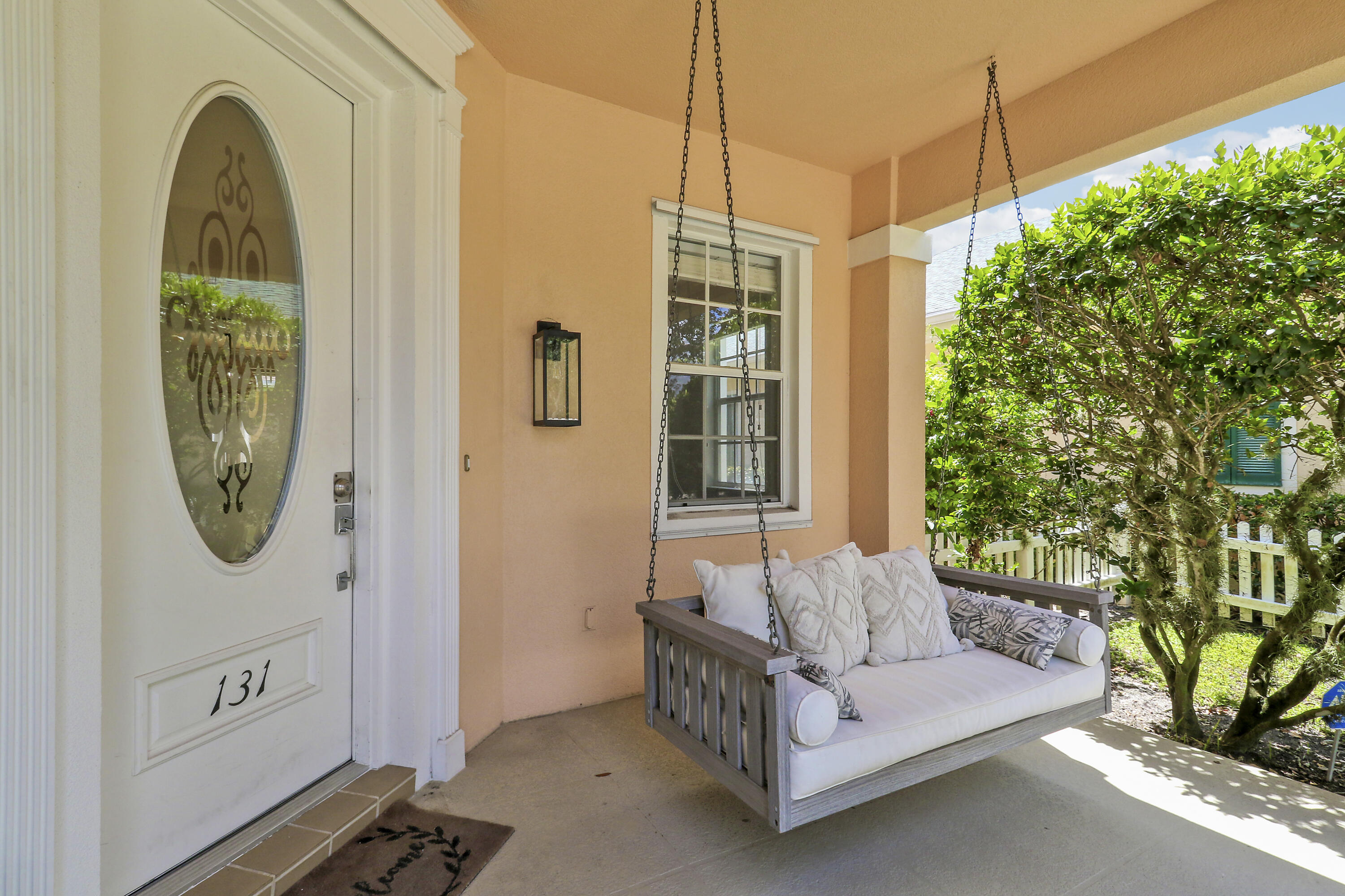 131 Rockingham Road Jupiter, FL 33458 - Photo 4 of 40 a spacious bedroom with a bed a mirror and a window