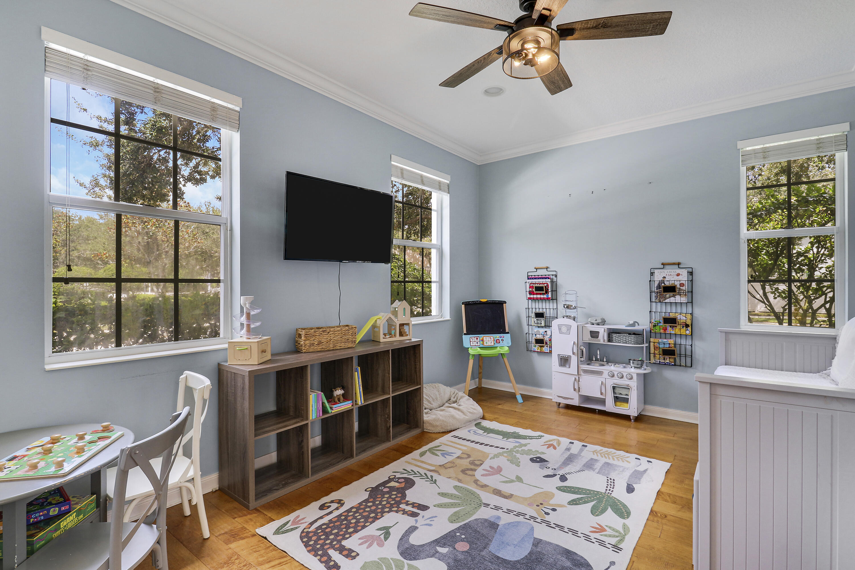 131 Rockingham Road Jupiter, FL 33458 - Photo 6 of 40 a living room with furniture and a flat screen tv