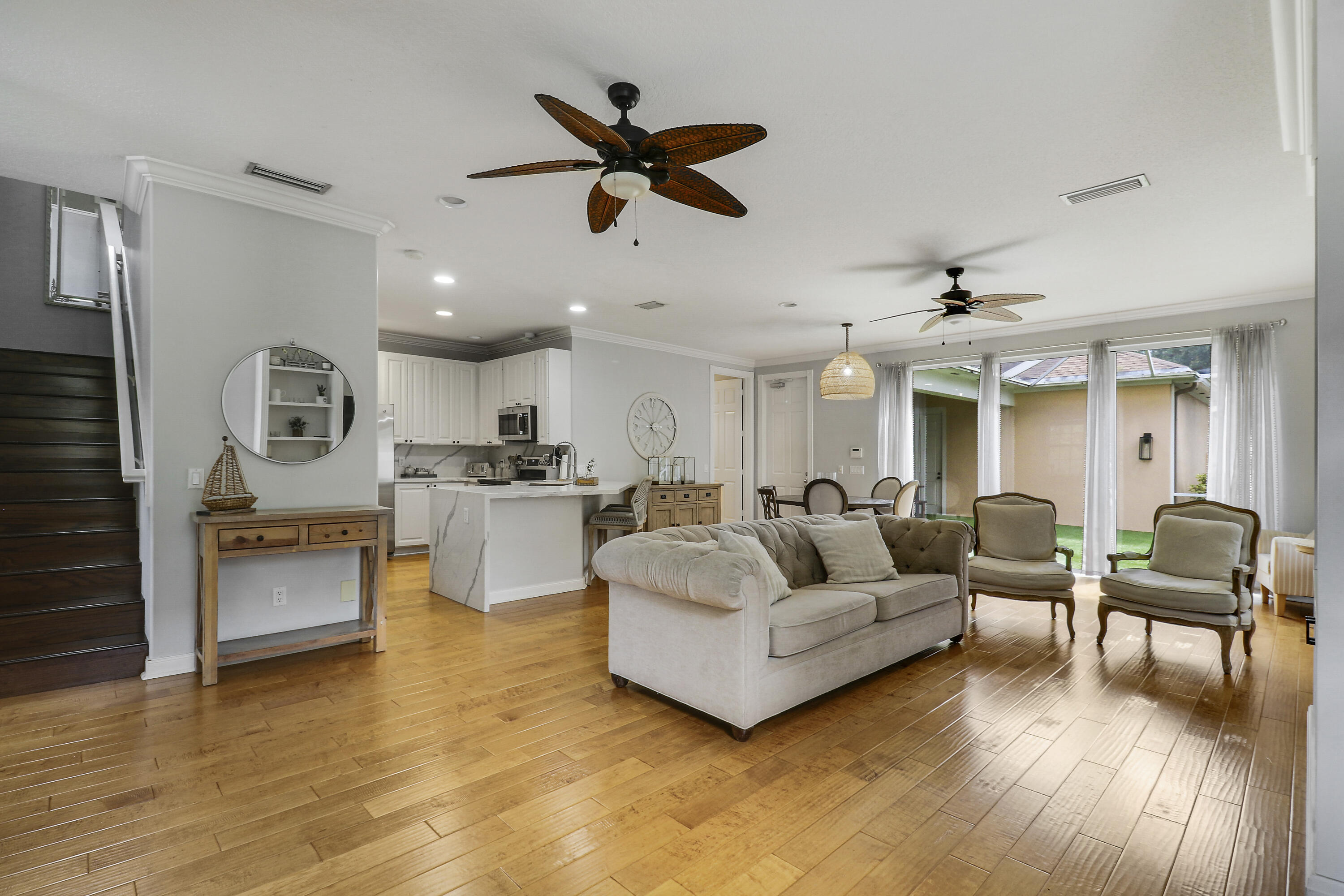 131 Rockingham Road Jupiter, FL 33458 - Photo 7 of 40 a living room with furniture and kitchen view
