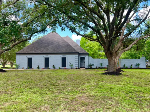 a house with a tree in front of it