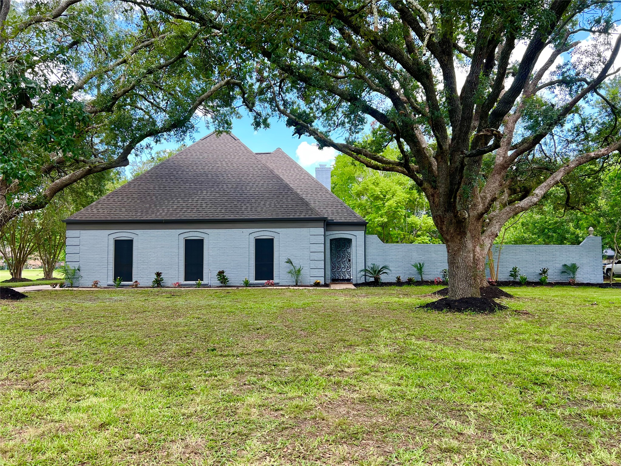 a house with a tree in front of it