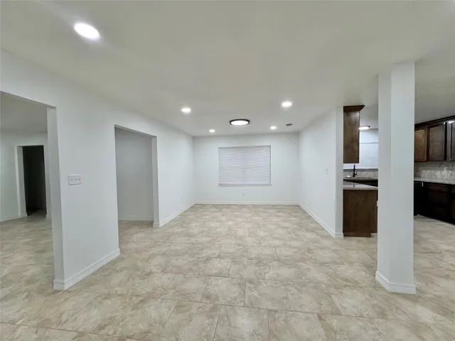 an empty room with a empty space and window