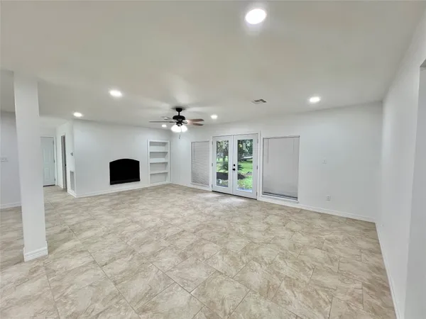 a view of a kitchen with a sink and a refrigerator
