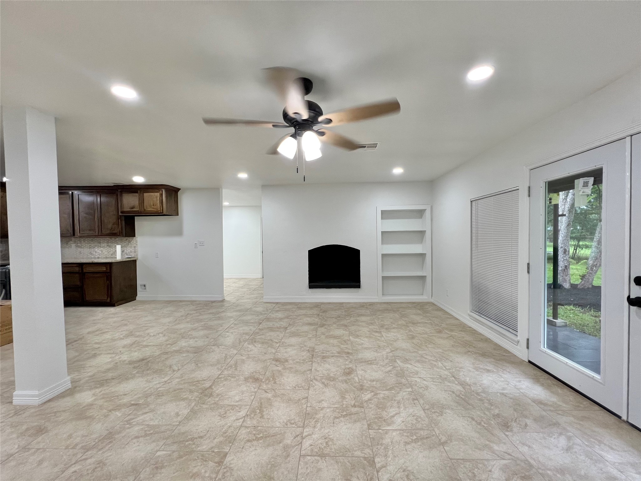 5 Colony Drive Angleton, TX 77515 - Photo 17 of 34 a view of an empty room with a kitchen and a window