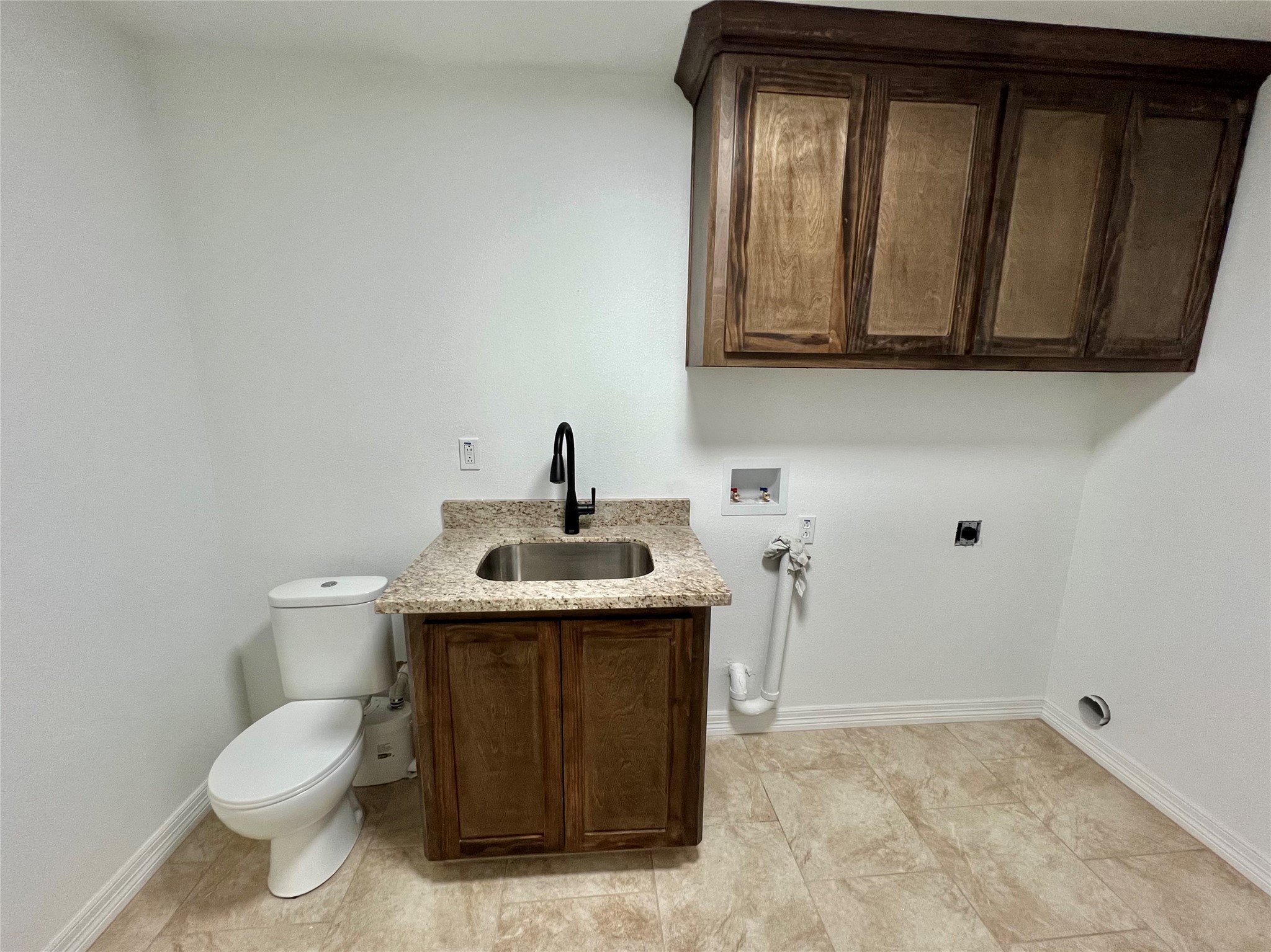 5 Colony Drive Angleton, TX 77515 - Photo 24 of 34 a bathroom with a toilet sink and mirror